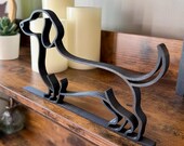 Close angled view of dachshund sculpture in continuous line art. Distinctive long body and playful design make it a unique gift for dachshund owners and pet lovers.