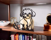 Close-up of a matte black Maltipoo line art sculpture in profile, glowing candles backlighting the fluffy curly silhouette — 3D printed minimalist Maltipoo decor and a unique Maltipoo gift for Maltipoo moms, doodle dads, and dog lovers who love modern shelf decor.
