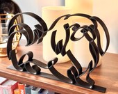 Black Pekingese continuous line sculpture displayed on wood shelf with warm candlelight, unique gift for Pekingese mom or dad home decor