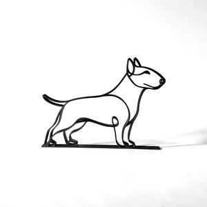 Clean continuous line art design of a bull terrier on a white background, showing the full minimalist dog silhouette and breed-specific proportions of the bull terrier — modern 3D printed dog sculpture design, minimalist bull terrier decor, and one-line dog art gift for dog lovers.