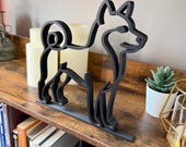 Side view of a 3D printed Shiba Inu silhouette statue with curled tail, black matte finish, displayed as pet lover gift and Japanese dog breed decor.