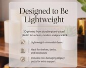 May include: A clear, modern image with text that reads "Designed to Be Lightweight." The text describes 3D-printed decor made from plant-based plastic. The image highlights lightweight minimalist decor, ideal for shelves, desks, and bookcases.