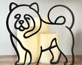 Minimal black Chow Chow line art shelf decor with books and candles, thoughtful Chow Chow gift for dog parents and breed lovers.