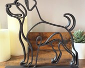 Close-up of the Rottweiler line art sculpture highlighting the bold silhouette and crisp edges.