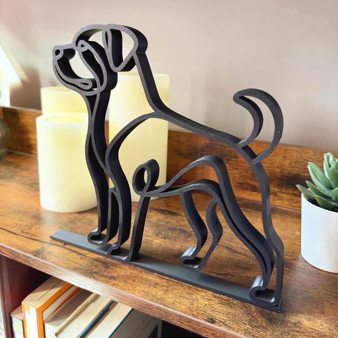 Minimalist Rottweiler sculpture styled in a modern living space, blending with warm and contemporary decor.