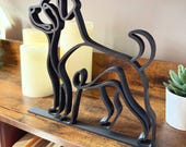Minimalist Rottweiler sculpture styled in a modern living space, blending with warm and contemporary decor.