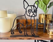 Full styled shot of Boston Terrier sculpture centered on a shelf. Minimalist dog decor in single line art design, perfect for gifting, bookshelf styling, or honoring a beloved pet.