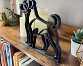 Wide side angle view of a 3D printed Rottweiler line art figure, showing layered design and smooth matte finish.