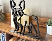 Close side view of a French Bulldog line art figure with upright ears. Matte black finish, designed as contemporary shelf and desk decor for dog lovers.