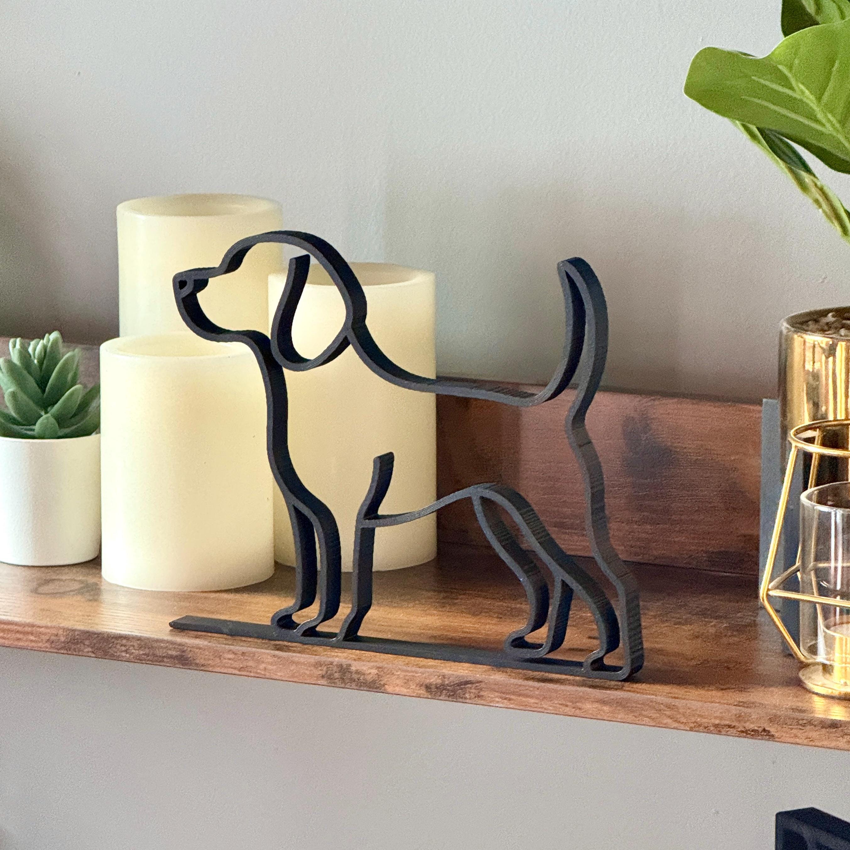 Matte black Golden Retriever line art sculpture as a tasteful pet memorial piece