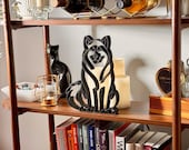 Front view of Alaskan Malamute continuous line art sculpture in matte black PLA.
