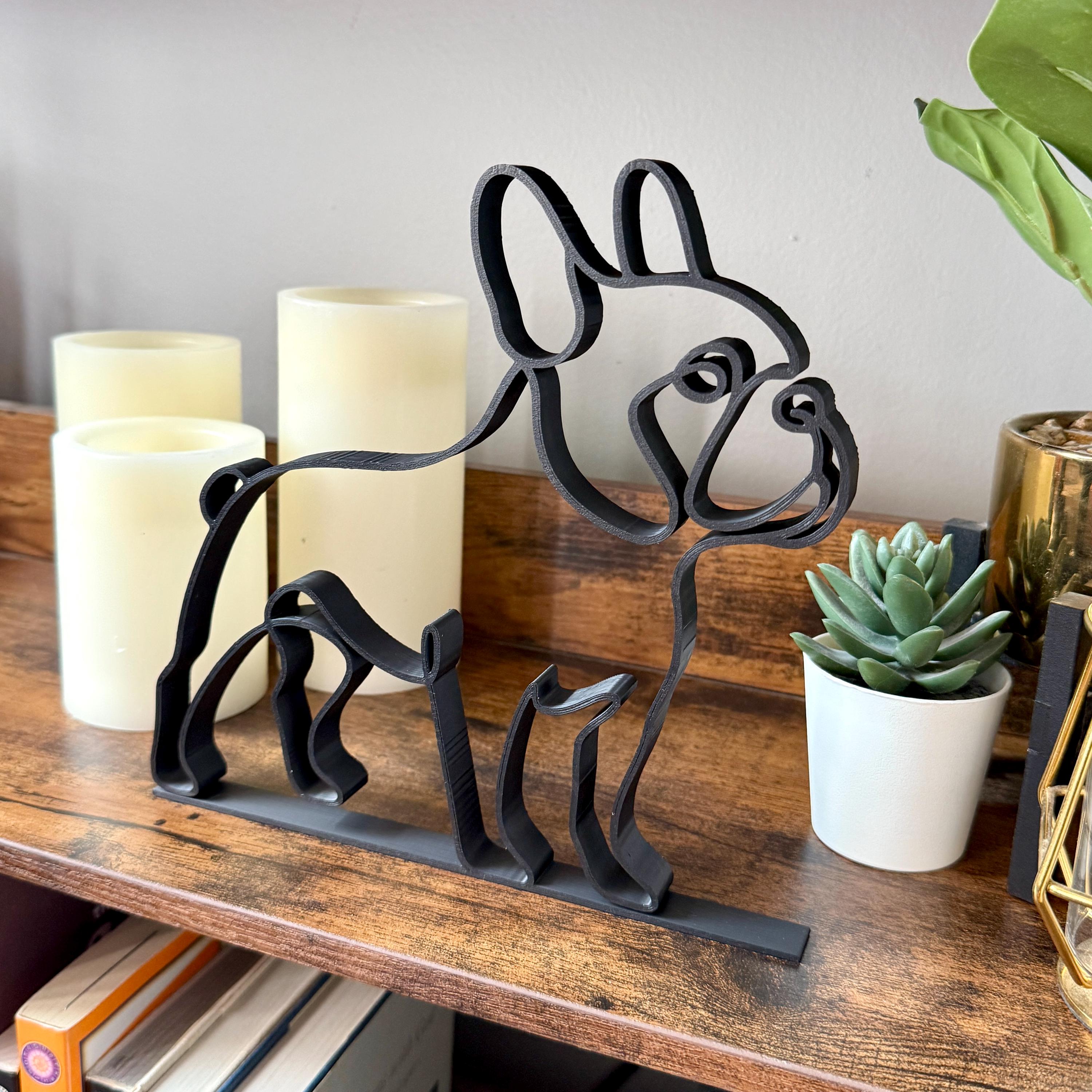 Matte black French Bulldog line art sculpture with signature bat ears