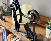 Side view of Husky silhouette sculpture in matte black, Scandinavian shelf decor for dog enthusiasts