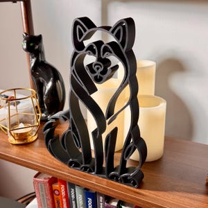 Alaskan Malamute minimalist sculpture styled on a shelf as modern home decor.