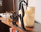 Three-quarter view of a custom Italian Greyhound minimalist sculpture with warm ambient lighting, emphasizing the elegant profile and modern shelf décor styling.