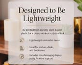 May include: A clear, modern image with text that reads "Designed to Be Lightweight." The text describes 3D-printed decor made from plant-based plastic. The image highlights lightweight minimalist decor, ideal for shelves, desks, and bookcases.