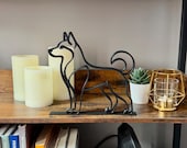 Minimalist black Husky line art sculpture on a wooden shelf with candles and a succulent, modern dog lover home decor