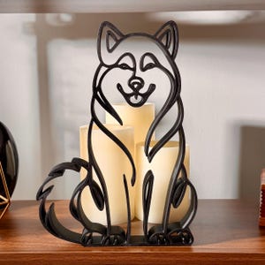 Matte black 3D printed Alaskan Malamute line art sculpture shown as minimalist dog decor.