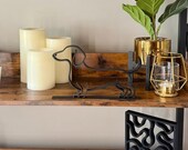 Dachshund line art sculpture styled with greenery, candles, and modern gold decor. Lightweight yet bold, ideal for shelf styling, dog lover gifts, or home accents.