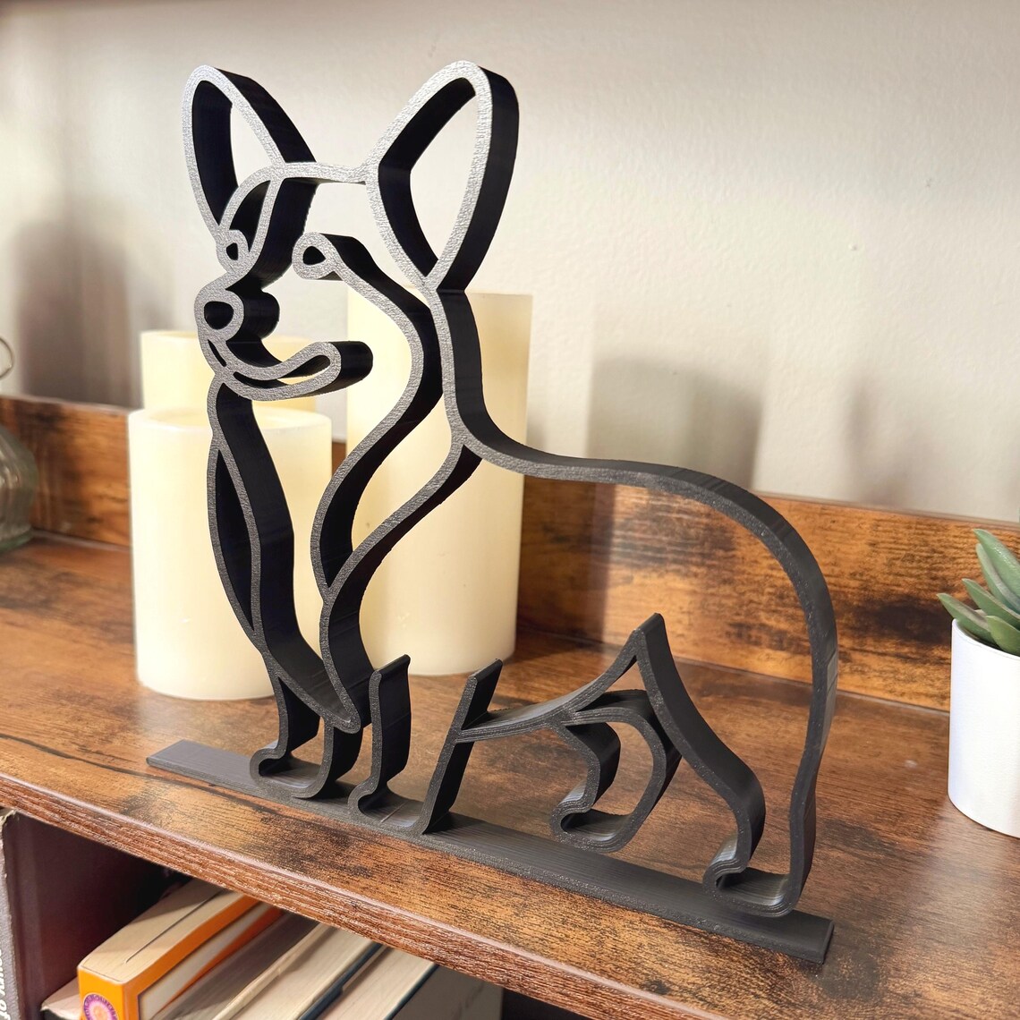 Minimalist Corgi silhouette shelf sitter in black, modern line art dog figurine for bookshelf, desk, or mantle decor.