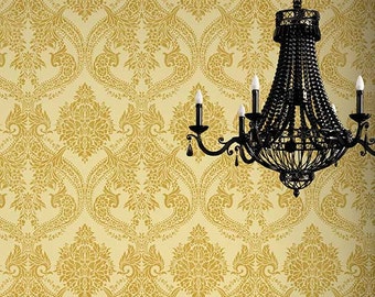 May include: A black metal chandelier with a beaded design hangs in front of a wall with a gold damask pattern.
