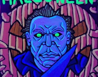 May include: A square Halloween-themed painting featuring a blue-toned portrait of a menacing figure with glowing green eyes, holding a blue knife. The word "HALLOWEEN" is written in green above the figure.
