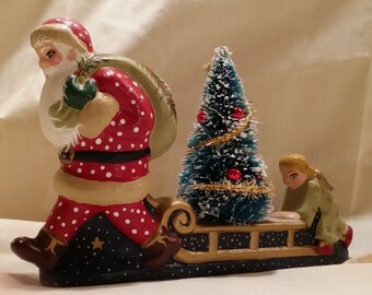 Santa y Ángel entregan el árbol de Navidad