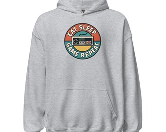 Unisex gamer hoodie - retro “Eat Sleep Game Repeat” badge, cozy style. Gift gaming / video games / geek.