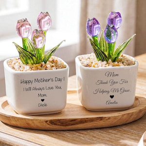 May include: Two white ceramic pots with glass tulip flowers, set on a wooden tray. One pot reads "Happy Mother's Day! I Will Always Love You, Mom, Chole." The other reads "Mom, Thank You For Helping Me Grow, Amelia."