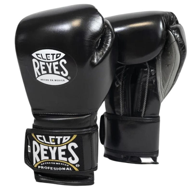 A pair of Black Cleto Reyes leather boxing gloves featuring a hook-and-loop closure, white inner thumb, and iconic branding.