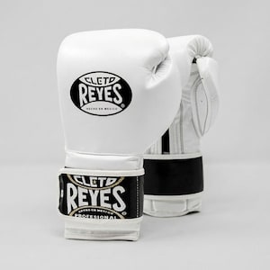 White Cleto Reyes professional boxing gloves featuring a hook-and-loop closure, white inner thumb, and iconic branding.