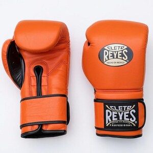 A pair of Orange Cleto Reyes professional boxing gloves featuring a hook-and-loop closure, Black inner thumb, and iconic branding.