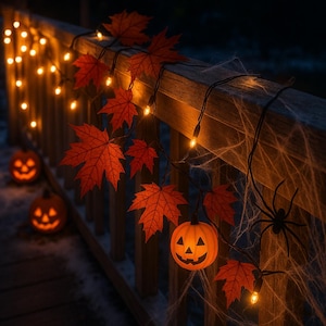 May include: A Halloween-themed outdoor decoration featuring a wooden railing adorned with string lights, orange maple leaf cutouts, and jack-o'-lantern lights. A spider and spiderweb complete the spooky scene.