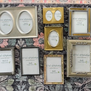 May include: A collection of vintage photo frames in various shapes and sizes, including rectangular and oval designs. The frames are in gold, silver, and black tones, with some featuring decorative details. Sizes include 3x4.5, 3.5x5, 4x5.5, and 4x6 inches. The text "Erin's Refinishing" is visible.