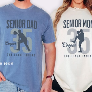 May include: Two t-shirts, one blue and one ivory, with baseball-themed graphics. The blue shirt says "SENIOR DAD" above the number 35, a baseball player silhouette, and "Cooper" and "THE FINAL INNING." The ivory shirt says "SENIOR MOM" with similar design elements.