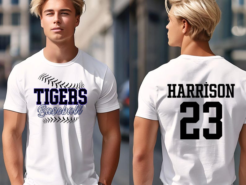 May include: White baseball t-shirt with "TIGERS Baseball" in navy blue and black stitching design on the front. The back of the shirt displays "HARRISON" and the number "23" in black.