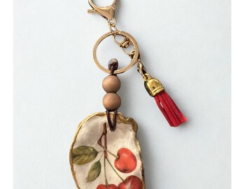 Decoupage Oyster-sleutelhanger met kersenmotief: handgemaakt cadeau