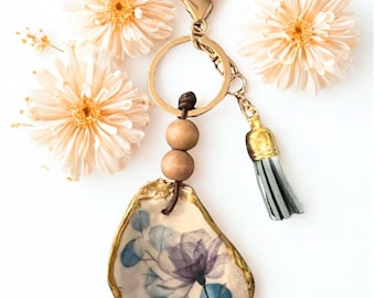Decoupaged Oyster-sleutelhanger met blauw bloemdessin: handgemaakt cadeau, schelpkunst, gunsten, verjaardagscadeaus