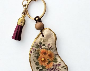 Decoupage Oyster-sleutelhanger met prachtig zonnebloemontwerp: handgemaakt cadeau