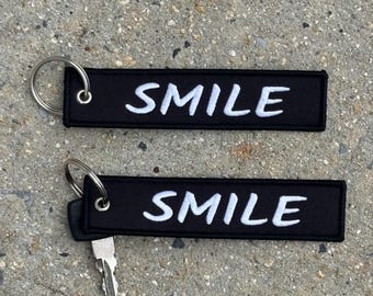 SMILE Jet Tag Keychain, Embroidered Keychain, Double Sided, Mental Health Reminder