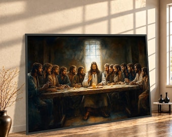 May include: A framed wall art print depicting the Last Supper, featuring a central figure with long hair and a beard seated at a long wooden table with twelve other figures in a dimly lit room with a bright window in the background.