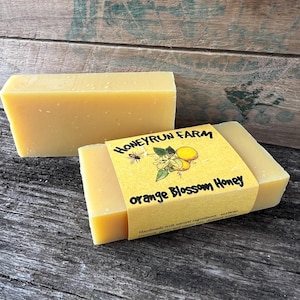 May include: Two bars of yellow soap with a label that reads "Honeyrun Farm Orange Blossom Honey" Handmade with natural ingredients, soy bean, coconut, palm and castor oils.  Unscented.