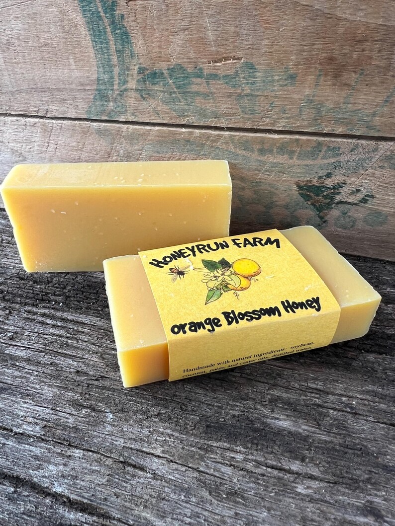 May include: Two bars of yellow soap with a label that reads "Honeyrun Farm Orange Blossom Honey" Handmade with natural ingredients, soy bean, coconut, palm and castor oils.  Unscented.