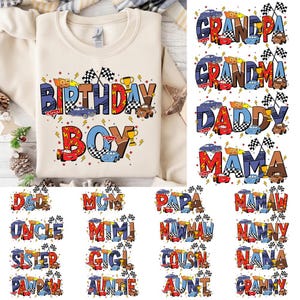 May include: A cream-colored sweatshirt with the words "BIRTHDAY BOY" in colorful letters, decorated with race cars, trophies, and lightning bolts. Additional designs include words like "GRANDPA", "GRANDMA", "DADDY", and "MAMA".