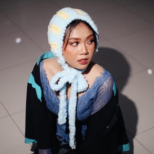 May include: A set of three ceramic mugs with a speckled, matte finish. The mugs are in cream, light grey, and dark grey. Each mug has a simple, minimalist design, ideal for coffee or tea.