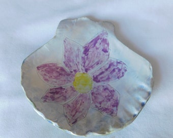 Purple Clematis flower in a Ceramic Seashell Dish
