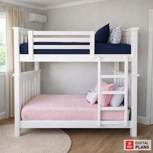 May include: A white bunk bed with a ladder, featuring a navy blue fitted sheet on the top bunk and a pink quilted bedspread on the bottom bunk. Decorative pillows in various colors add accents. The bed frame is made of wood.