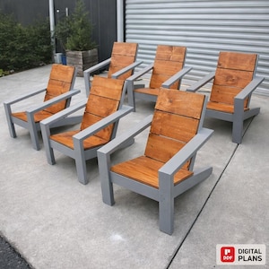 May include: Six wooden Adirondack chairs with a natural wood seat and back, and gray painted frames. The chairs are arranged in a row on a concrete surface, showcasing a modern outdoor furniture design.