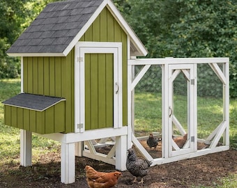 May include: A green and white chicken coop with a black shingled roof. The coop has a small nesting box and a wire-enclosed run. Three chickens are in the yard.