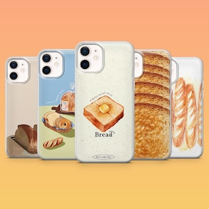 May include: A collection of phone cases with bread-themed designs. One case features a slice of toast with butter, another shows a loaf of bread, and others display bread slices and rolls. The cases have a white or light blue background.